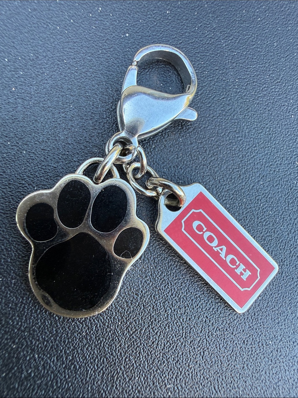 Coach Black Paw Print Charm with Red Logo Tag